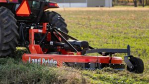Land Pride RCF2760 Rotary Cutter attachment on the back of a tractor.