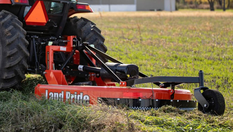 Land Pride RCF2760 Rotary Cutter attachment on the back of a tractor.