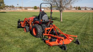 New Land Pride FDR16 Series Grooming Mowers mowing a green plot of land.