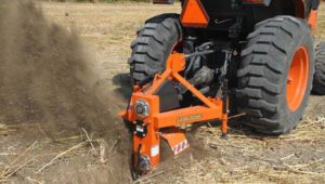 Land Pride Series Ditcher DT35 digging a trench in a field.