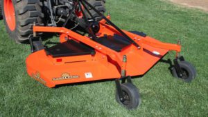 Land Pride FDR36 Series Grooming Mowers on a green field attached to a Kubota tractor.