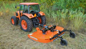New Land Pride RCF3610 Series Rotary Cutters attached to Kubota tractor clearing a field.
