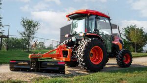 Kubota tractor with a Land Pride RB37 Series Rear Blade attached to the back.