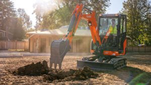 New Kubota-KX030-4 Excavator working in residential area.