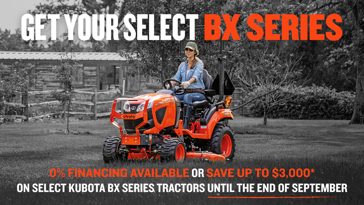 Kubota BXSeries tractor in a pasture or rural area.