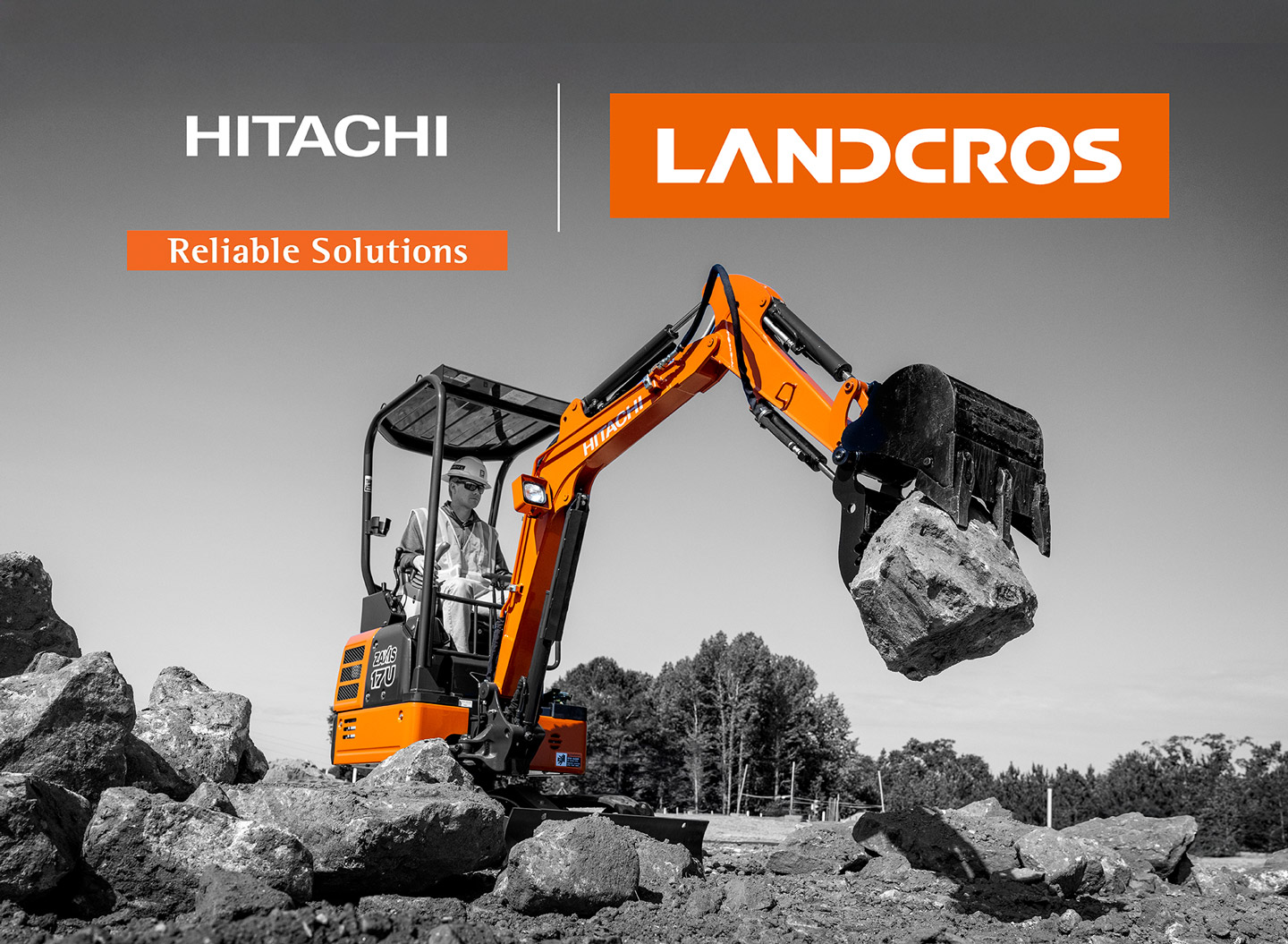 Excavator at a work site with Hitachi and Landcros logos.