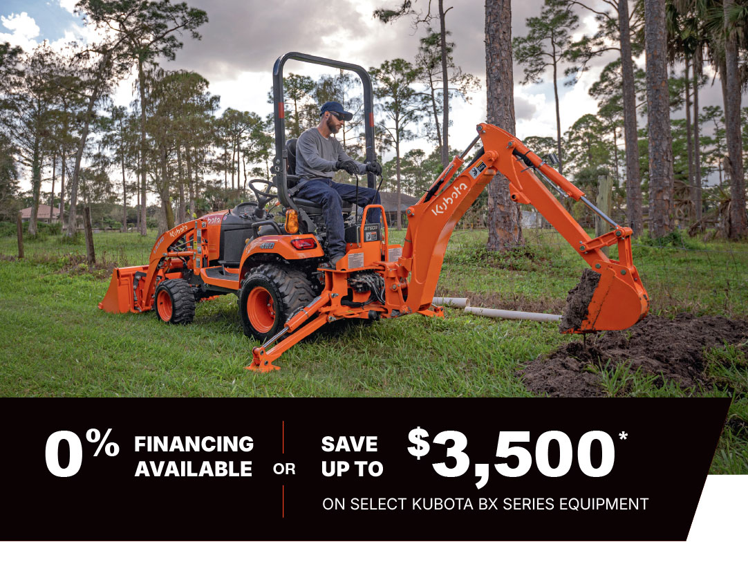 http://Man%20in%20a%20forested%20area%20with%20a%20Kubota%20BX-Series%20subcompact%20tractor.